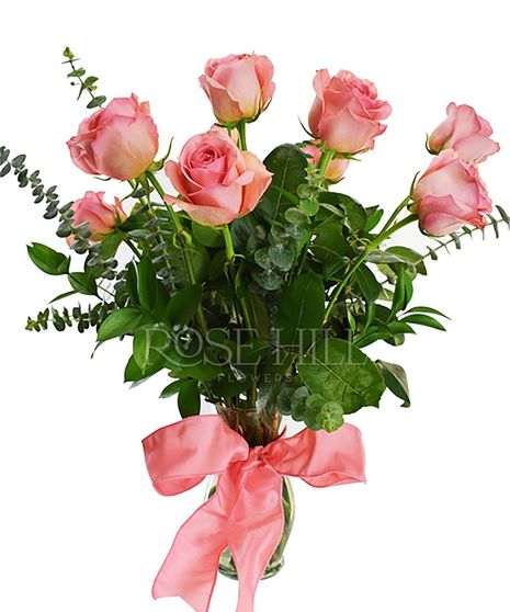 One dozen long-stemmed roses and greenery