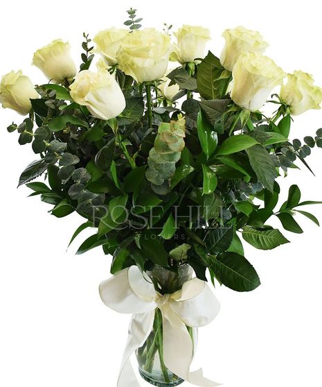 One dozen long-stemmed roses and greenery